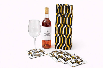 White, black, & gold wine bag & four piece coaster set on a white background