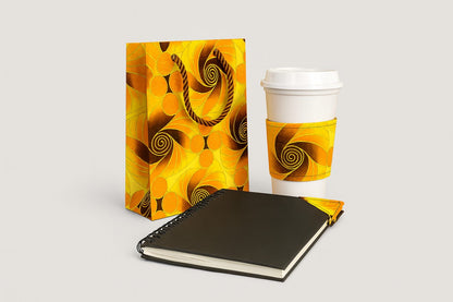 Yellow, orange, brown, & gold extra small gift bag, cup sleeve, & bookmark on a white background
