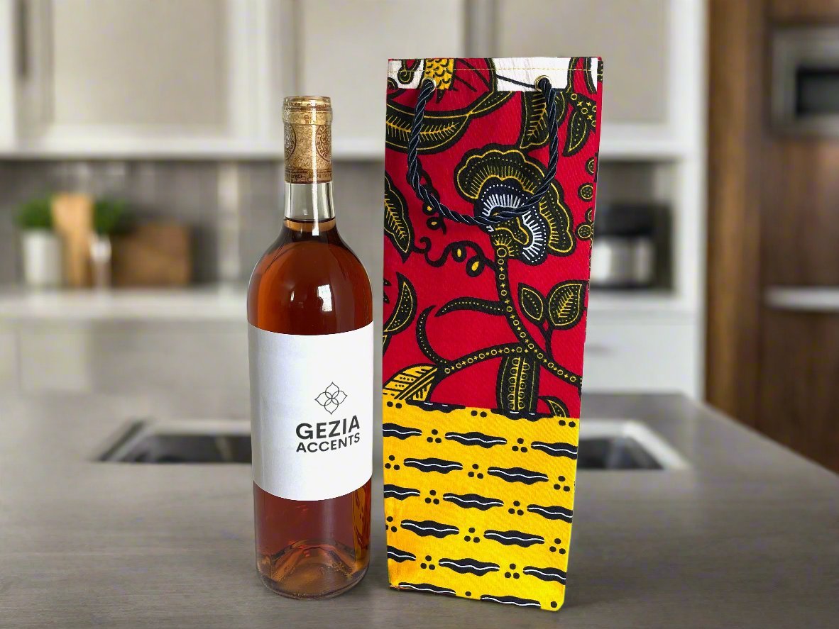Handmade African fabric wine gift bag lifestyle shot on a counter with a bottle of wine in a kitchen.