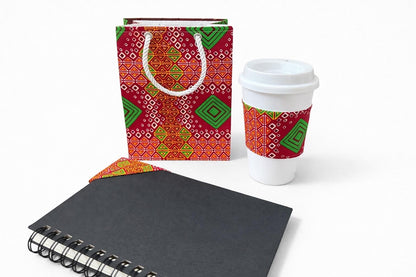 Red, yellow, green, & white extra small gift bag, cup sleeve, & corner bookmark on a white background